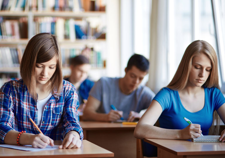 Highschool students carrying out written task